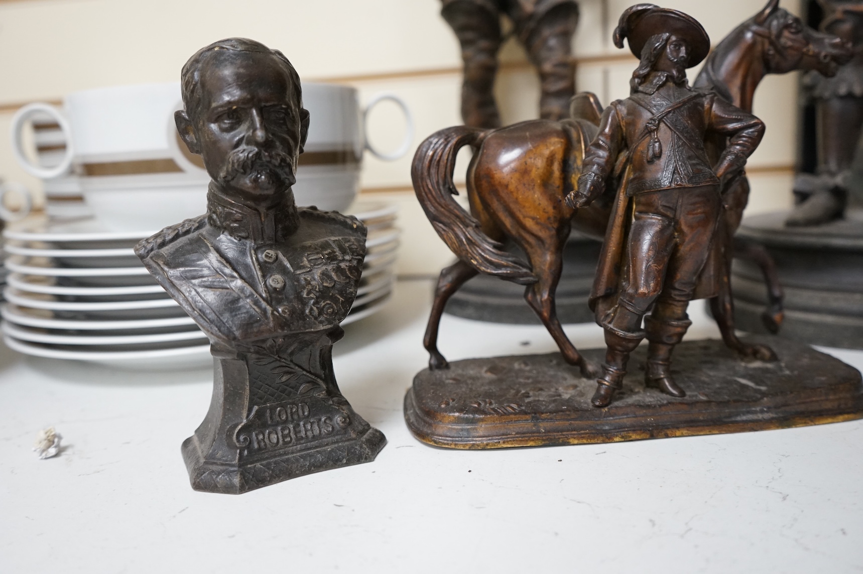 A pair of bronzed spelter figures, another pair of busts and a bronzed spelter group of a Cavalier and his horse, tallest 52cm